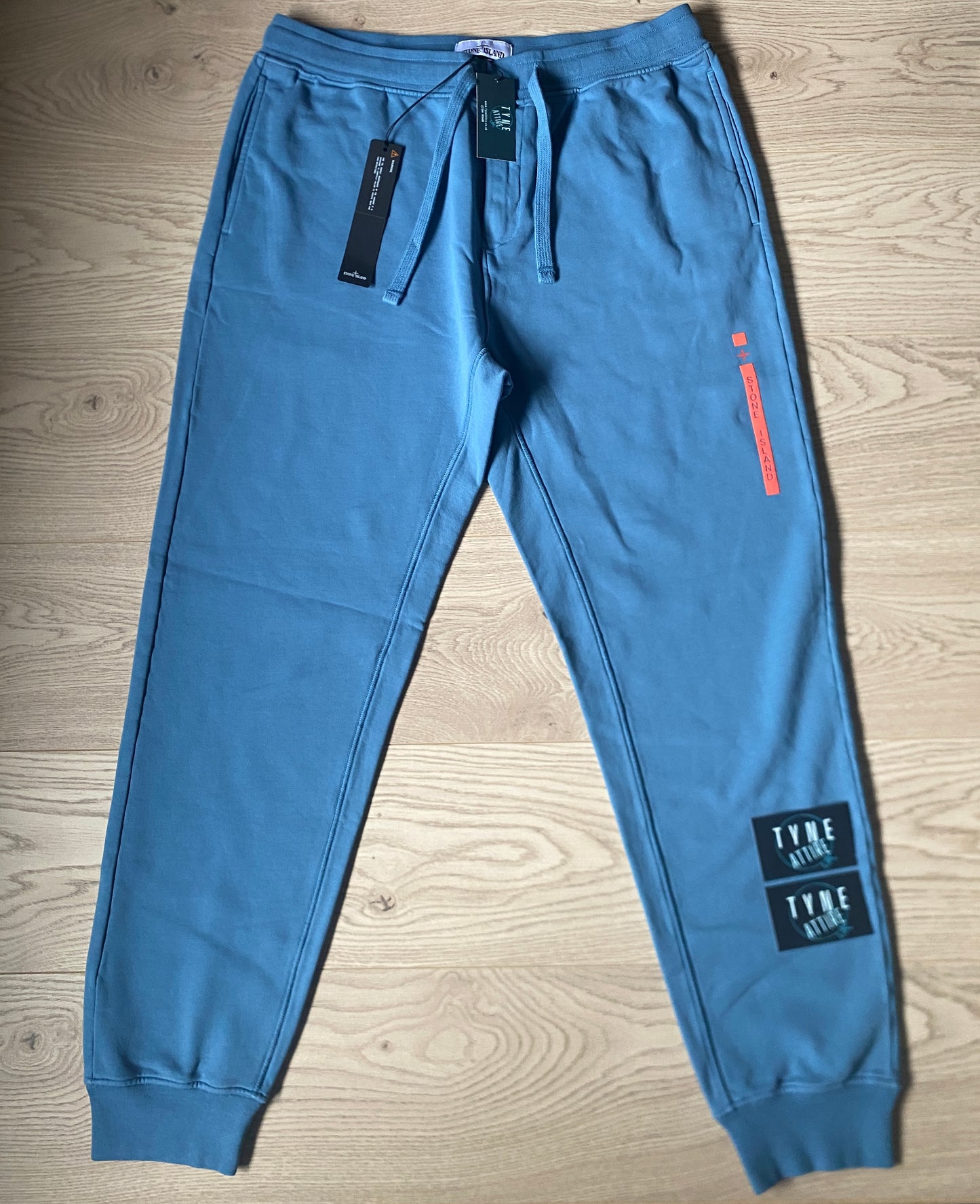 Stone Island 65985 ‘Micro Graphics Four’ Spellout Logo Mid Blue Cuffed Joggers