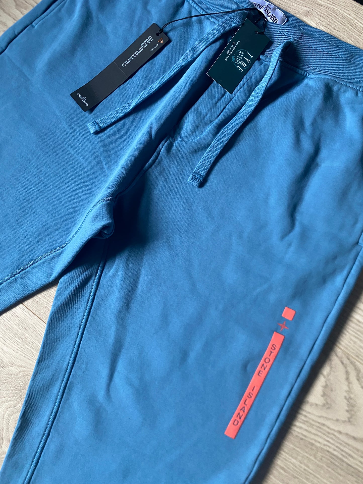 Stone Island 65985 ‘Micro Graphics Four’ Spellout Logo Mid Blue Cuffed Joggers