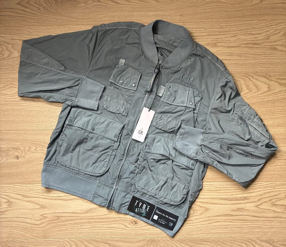 C.P. Company Chrome-R Nylon Garment Dyed Multi Pocket Embroidered Spellout Logo Sky Blue Bomber Jacket