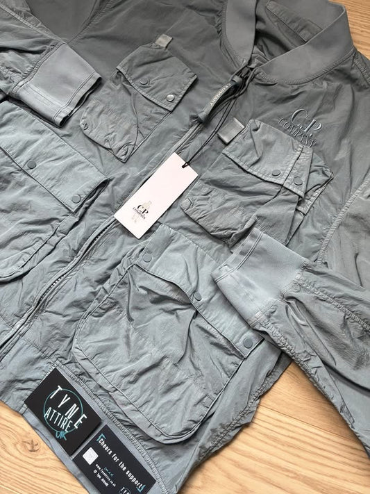 C.P. Company Chrome-R Nylon Garment Dyed Multi Pocket Embroidered Spellout Logo Sky Blue Bomber Jacket